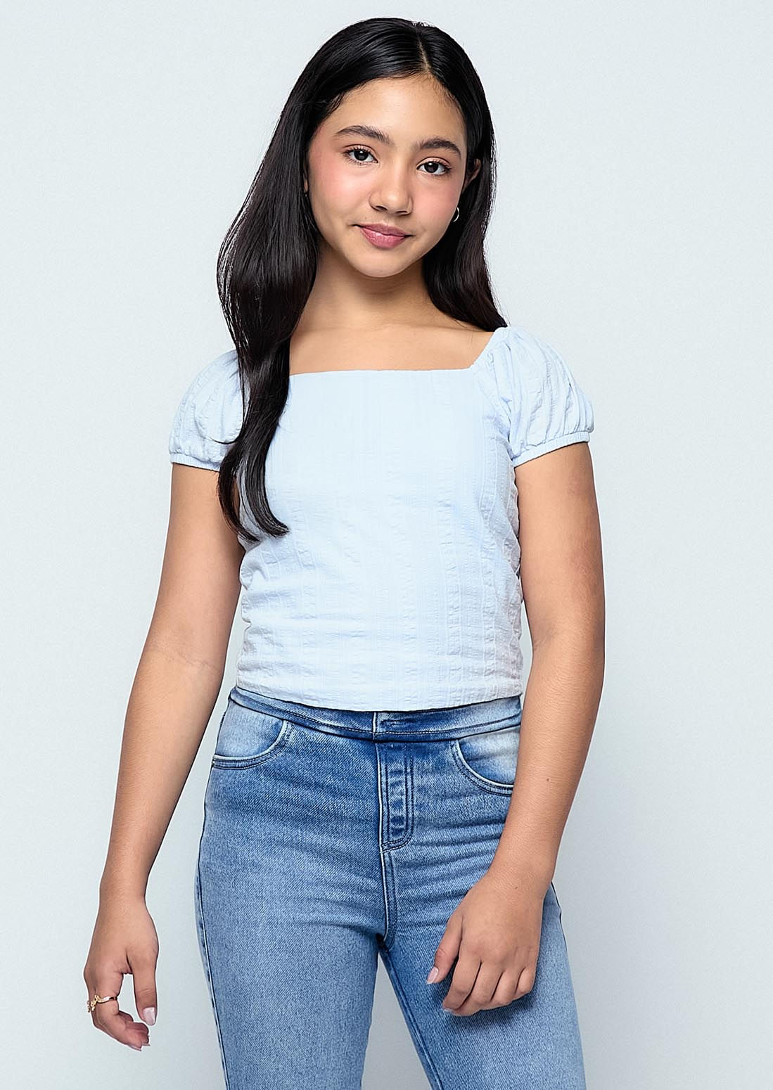 Blusa azul claro con nido de abejas para niñas