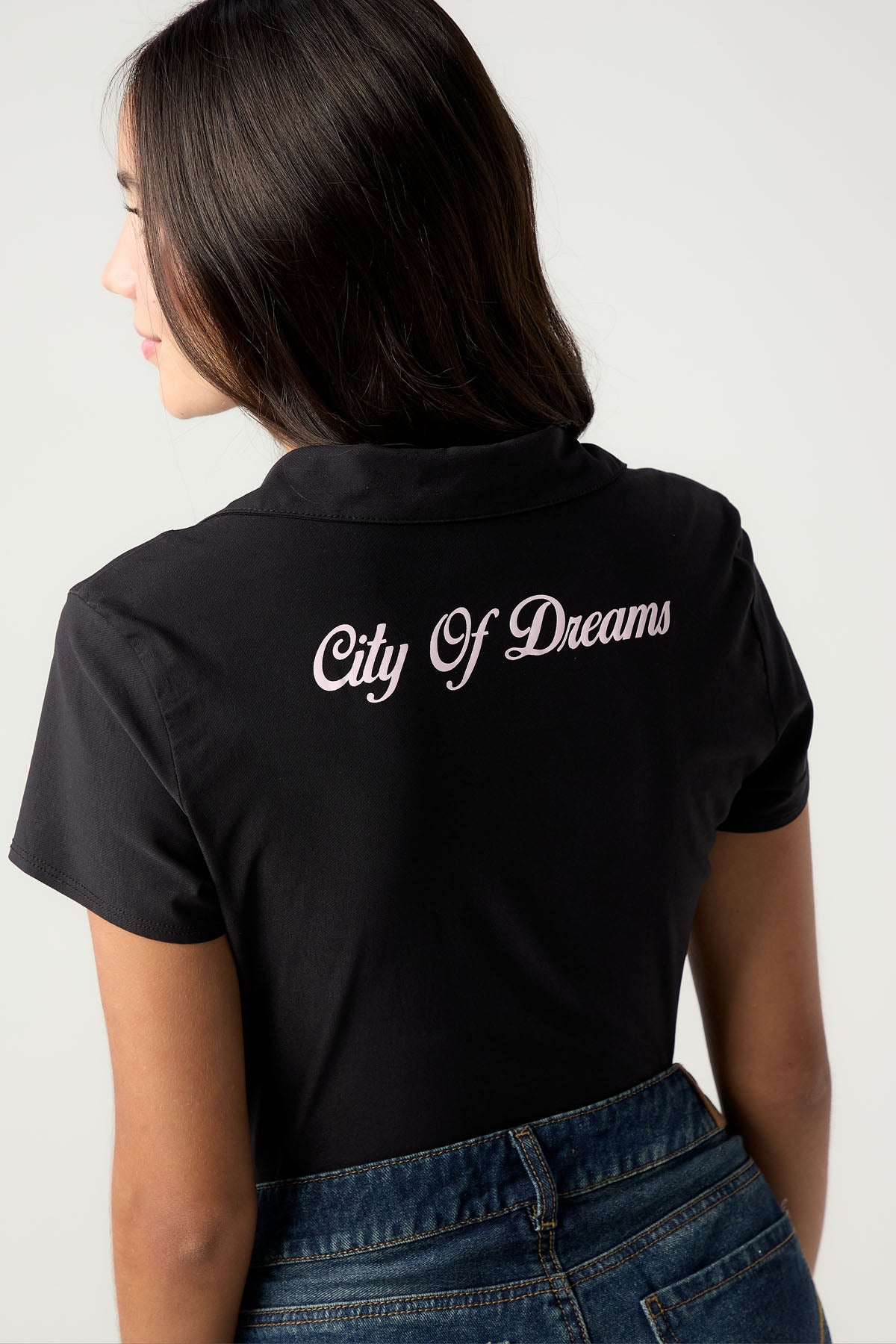 Blusa negra con cierre doble cabeza para jóvenes