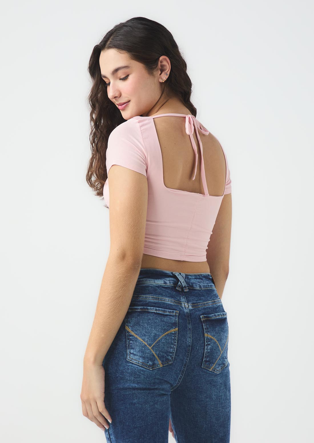 Blusa palo de rosa con cortes en centro para jóvenes