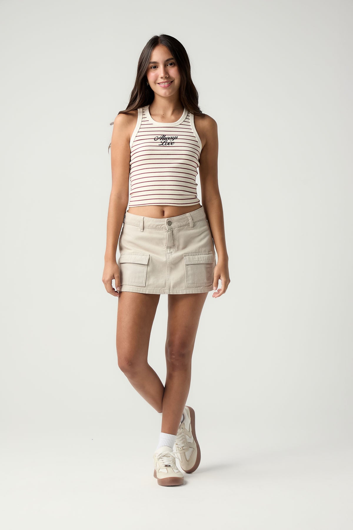 Falda short arena de tiro medio para jóvenes