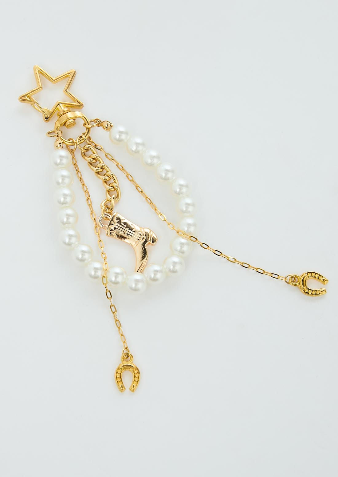 Llavero dorado con perlas