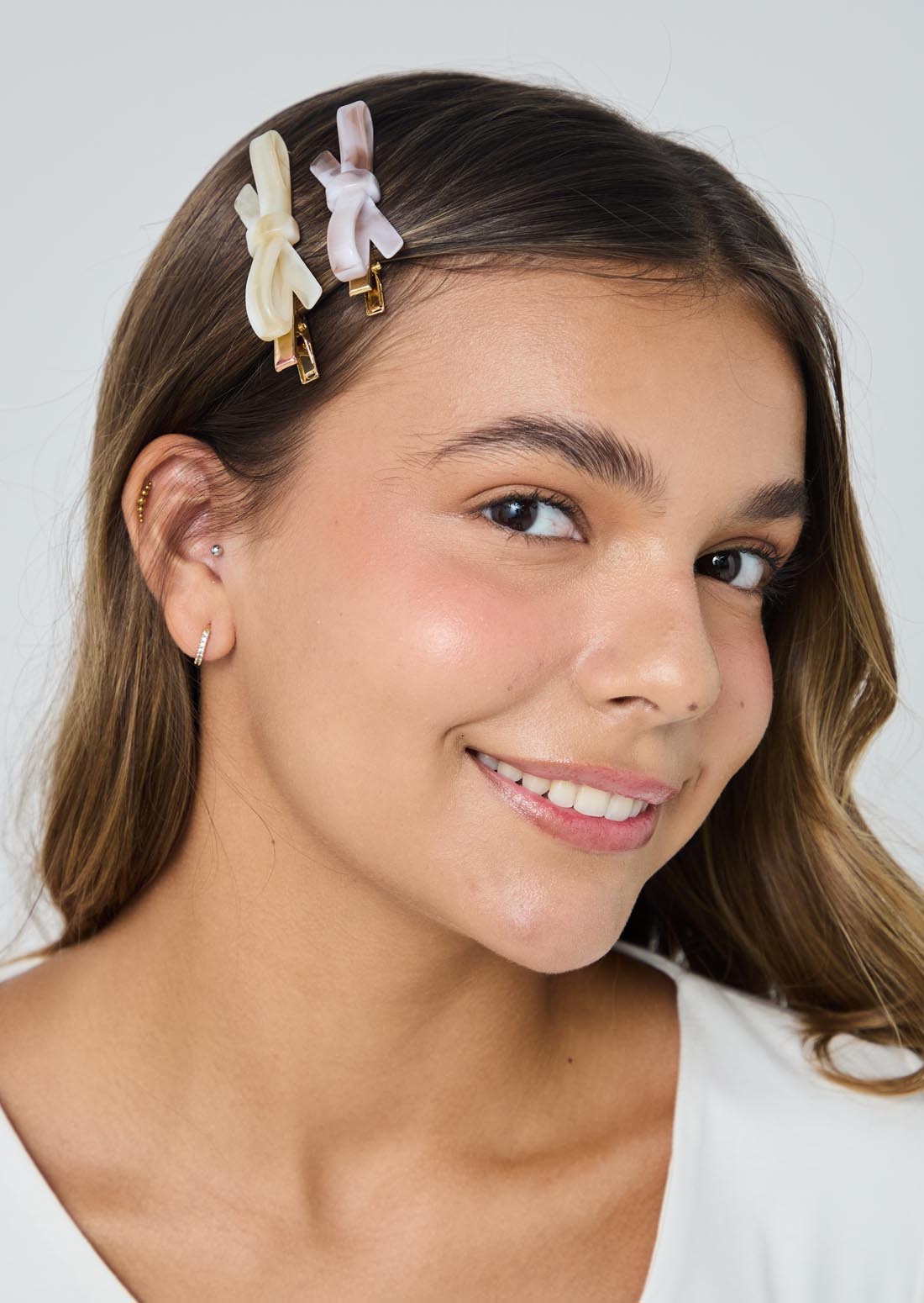 Duo de pinzas en forma de moño para el cabello