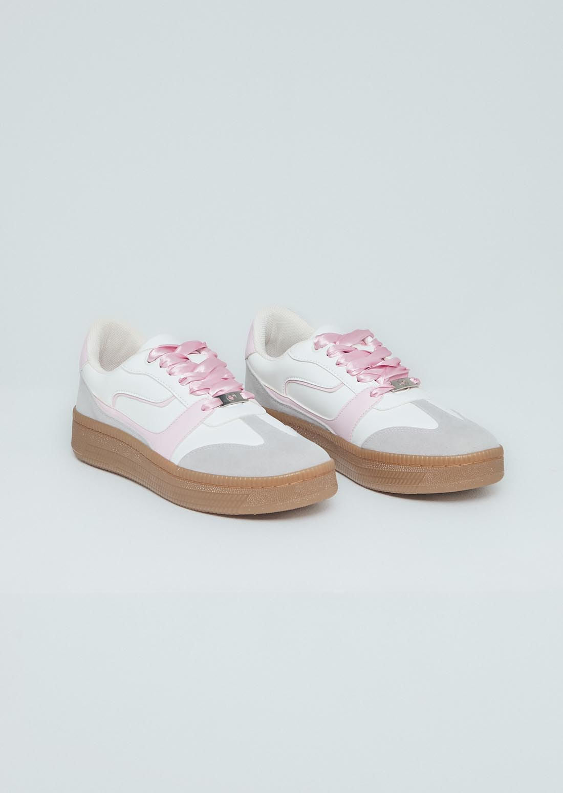 Tenis rosa con cordones en lazo para adolescentes
