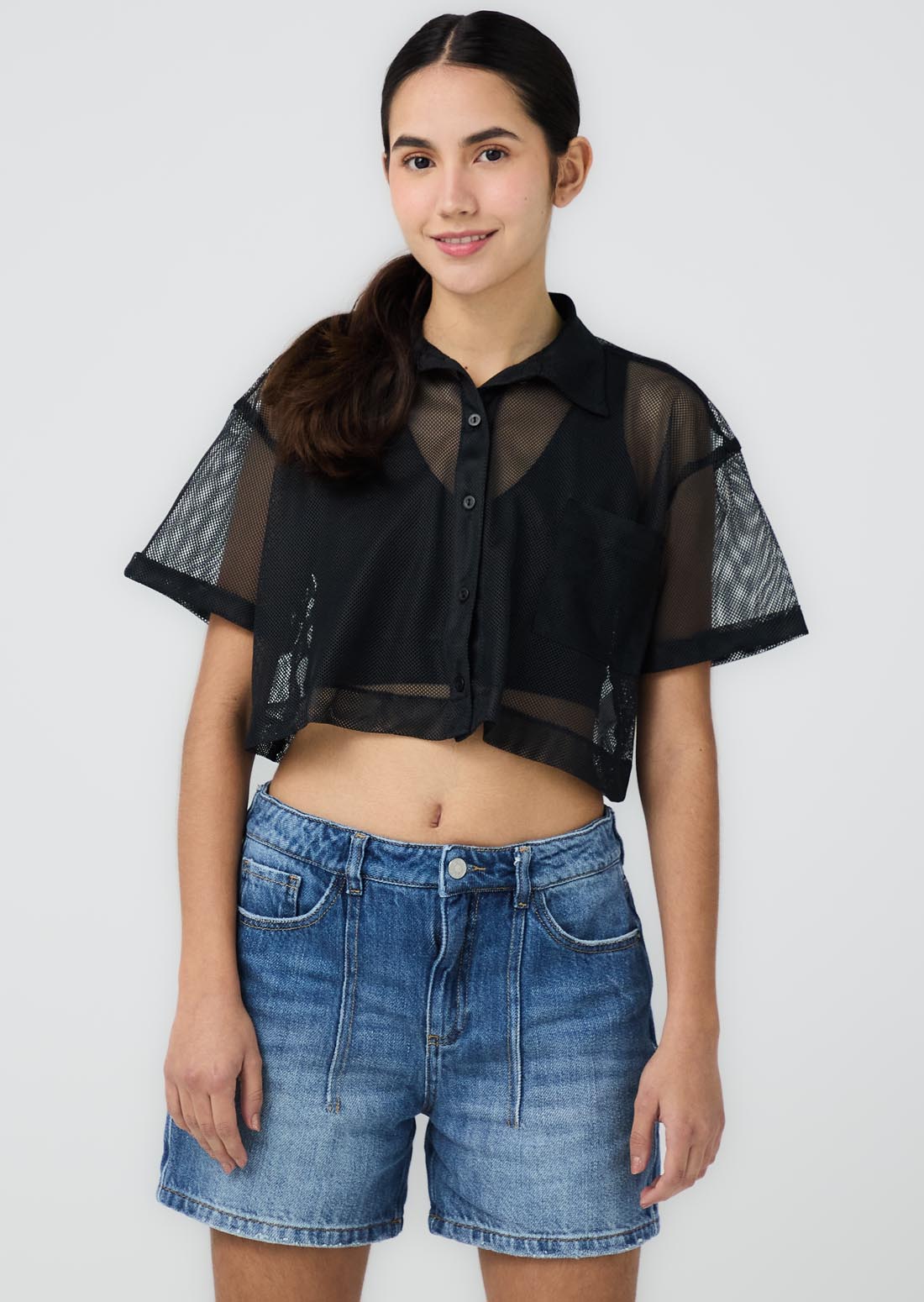 Blusa negra doble prenda para jóvenes