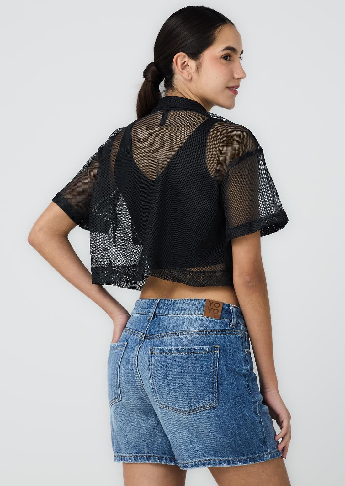 Blusa negra doble prenda para jóvenes