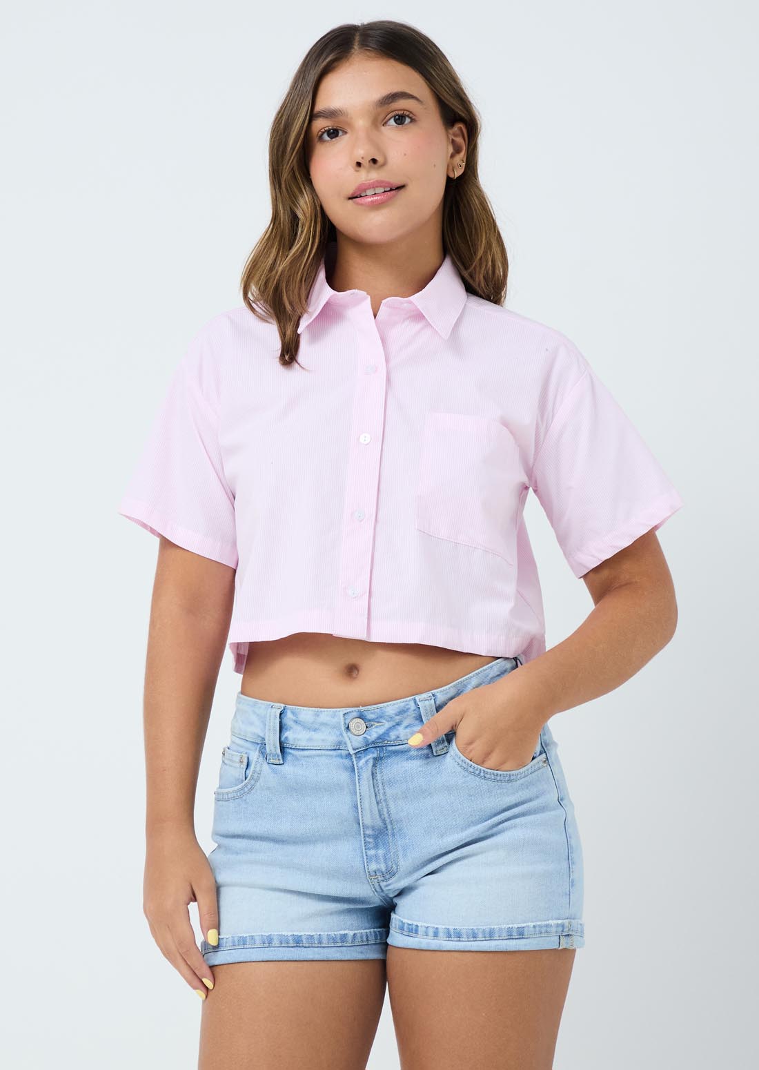Blusa rosada con bolsillo en frente para jóvenes