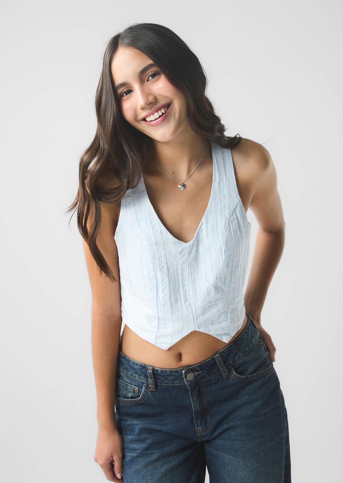 Blusa azul claro con cierre en costado para jóvenes