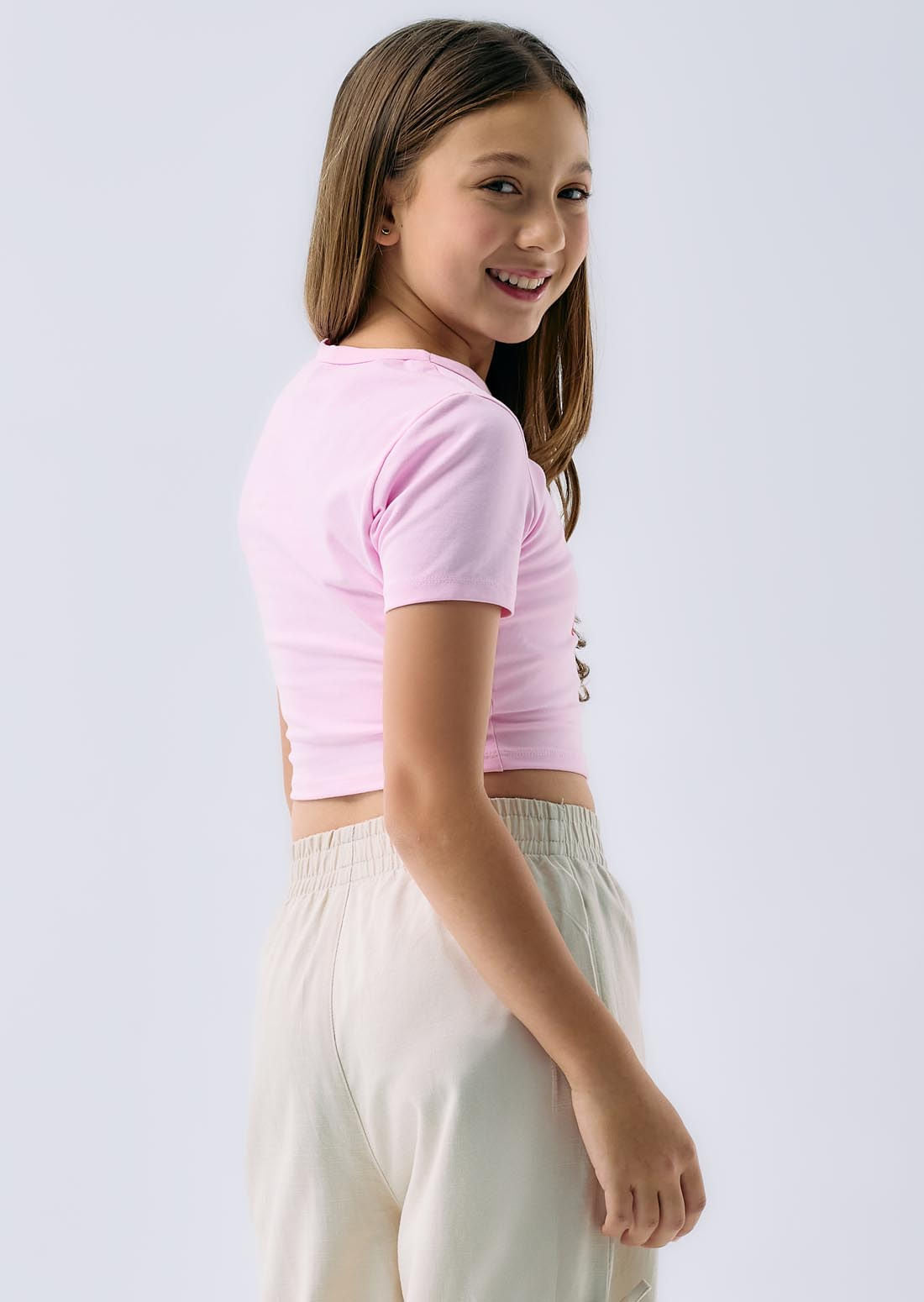Camiseta crop rosa claro estampada para niñas