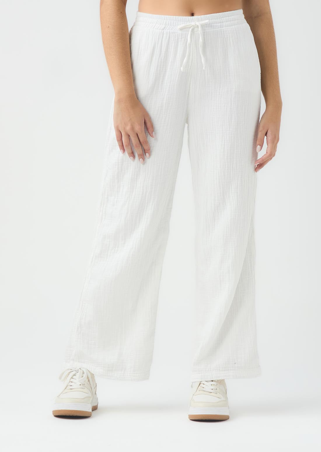 Pantalón marfil con pretina elástica para jóvenes