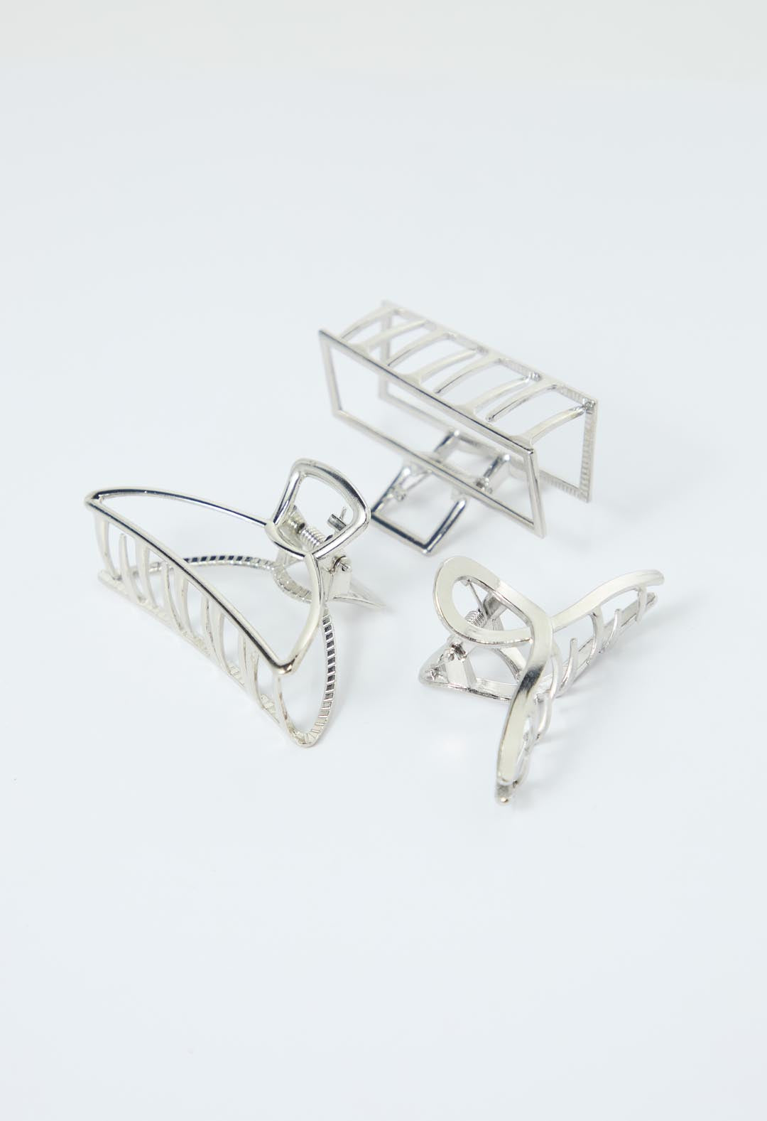 Pinzas plateadas metálicas para el cabello